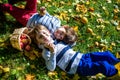 Girl and two boys lay on the grass and eat apples Royalty Free Stock Photo