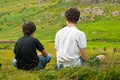 Two boys looking at a beautiful landscape