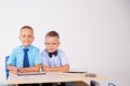 The two boys are looking at Internet Tablet school Royalty Free Stock Photo