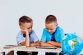 The two boys are looking at Internet Tablet school Royalty Free Stock Photo