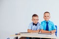 The two boys are looking at Internet Tablet school Royalty Free Stock Photo