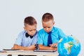 The two boys are looking at Internet Tablet school Royalty Free Stock Photo