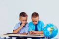 The two boys are looking at Internet Tablet school Royalty Free Stock Photo