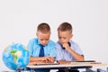 The two boys are looking at Internet Tablet school Royalty Free Stock Photo