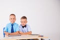 The two boys are looking at Internet Tablet school Royalty Free Stock Photo