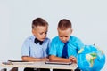 The two boys are looking at Internet Tablet school Royalty Free Stock Photo