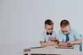 The two boys are looking at Internet Tablet school Royalty Free Stock Photo