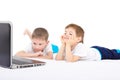 Two boys looking on laptop