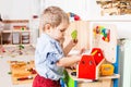 Boys play with wooden toys