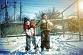 Two boys play with snow. Happy childhood. Brothers on a walk. two kids playing with snow. toned Royalty Free Stock Photo