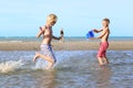 Two boys playing on the beach Royalty Free Stock Photo