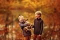 Two boys playing with a dog Royalty Free Stock Photo