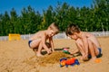 Two boys playing in the sand Royalty Free Stock Photo