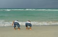 Two Boys Playing by the Shore Royalty Free Stock Photo