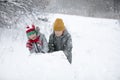 Two boys are playing in the snow Royalty Free Stock Photo