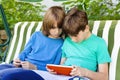 Two Boys Playing with Tablet