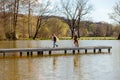 Two boys playing together outdoors, near to the lake. Water and sunny weather. Children have fun. Friendship. Beautiful Royalty Free Stock Photo