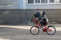Two boys ride bicycles on paved road. Children ride on Bicycle who is faster
