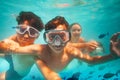 Two boys with scuba masks dive underwater in sea Royalty Free Stock Photo