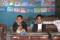 Two Boys sitting on their disks at school in Egypt Royalty Free Stock Photo