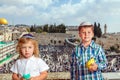 Two boys in skull-caps with etrog