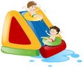 Two boys sliding down the water slide