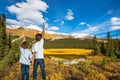 Two boys stand on coast of the lake