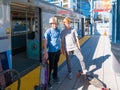 Two Boys Standing On Metro Light Rail Platform With Skateboards Royalty Free Stock Photo