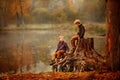Two boys on the stump Royalty Free Stock Photo