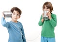 Two boys talking on a tin can phone Royalty Free Stock Photo