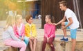 Two boys and three girls are talking about play on walk Royalty Free Stock Photo