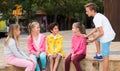 Two boys and three girls are talking about play on walk Royalty Free Stock Photo