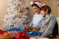 Two Boys Using Laptop by Christmas Tree Royalty Free Stock Photo