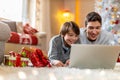 Two Boys Using Laptop by Christmas Tree Royalty Free Stock Photo