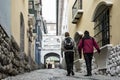 Two boys walk along Jaen street, a colonial cobbled street in La Paz, Bolivia