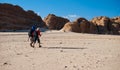 Two boys walking in the desert to canyon, Sinai