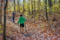 Two Boys Walking in Fall Forest