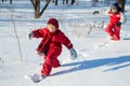 Two boys walking at the snow on park Royalty Free Stock Photo