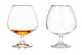 Two brandy glasses (empty and with alcohol) isolated on white ba Royalty Free Stock Photo