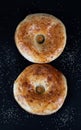 Two Bread in figure eight shape on a black background. Uzbek national food. 8 march concept