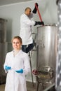 Two brewery workers on beer factory Royalty Free Stock Photo