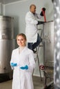 Two brewery workers on beer factory Royalty Free Stock Photo