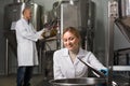 Two brewery workers on beer factory Royalty Free Stock Photo