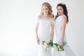 Two brides in white wedding gowns Royalty Free Stock Photo