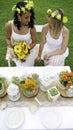 Two bridesmaids looking at each other after catching the bouquet. Two lesbian brides on their wedding day