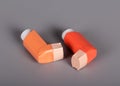 Two pocket inhalers for breathing on gray