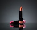 Two bright lipsticks on a black Royalty Free Stock Photo