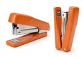 Two bright orange staplers on a white background Royalty Free Stock Photo