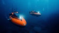 Two Orange Submersibles in the Ocean Royalty Free Stock Photo
