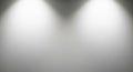 Two bright white spotlights illuminating a smooth gray gradient background with soft diffused light creating a clean Royalty Free Stock Photo